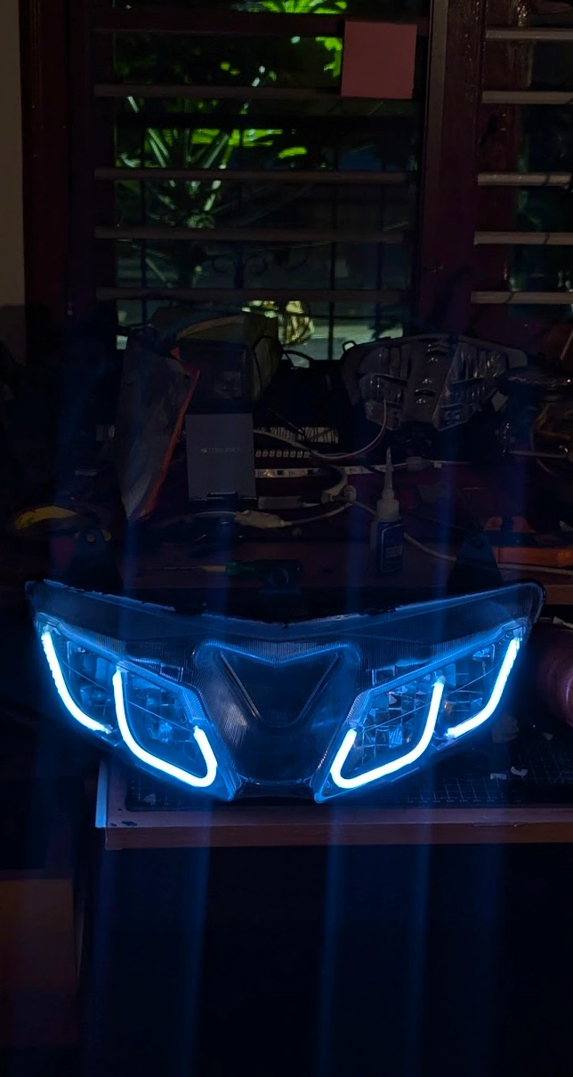 Custom motorcycle headlight assembly with blue LED DRL strips